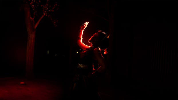 a woman holding gold jewelry with trembling hands and full of worries photo