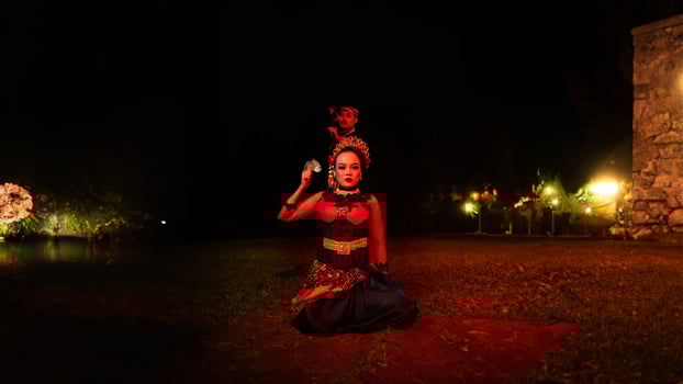 a female dancer in a red costume sat in the silence of the night which strengthened the sadness photo