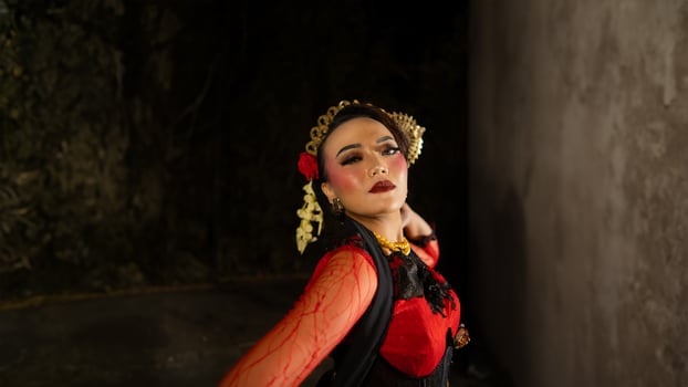 an Indonesian dancer shows a dance that shows the beauty of a tradition full of stories in every movement photo