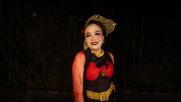An Indonesian dancer becomes an ambassador of cultural beauty and elegance by dancing on stage photo