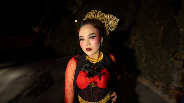 An Indonesian dancer becomes an ambassador of cultural beauty and elegance by dancing on stage photo
