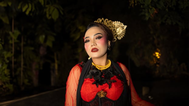 An Indonesian dancer becomes an ambassador of cultural beauty and elegance by dancing on stage photo