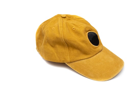 Mustard colored baseball cap, isolated on white background. For mockups. photo