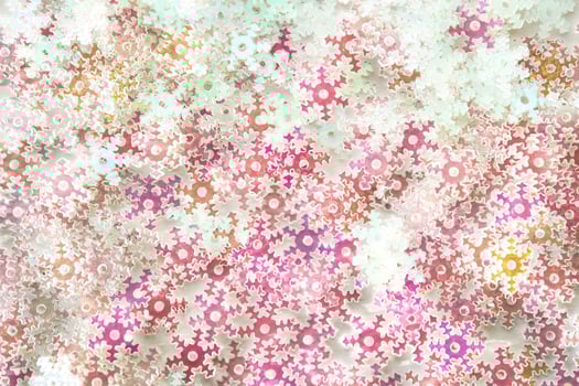 Sequins in the shape of snowflakes close-up. Background. photo