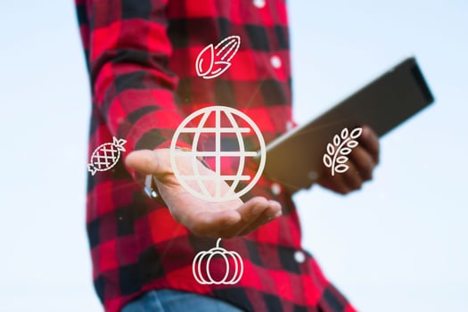 Man in checkered shirt using innovation for agriculture, IOT farming concept, internet data collection, smart farm photo