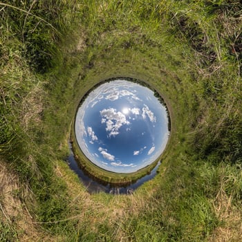 blue hole sphere little planet inside green grass round frame background photo