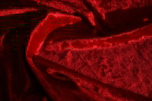 Abstract background made of red velvet fabric. photo