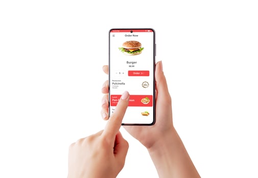 Woman's hands with smart phone isolated, ordering a burger via app or website concept. Seamless online experience for fast food cravings delivered at your fingertips photo
