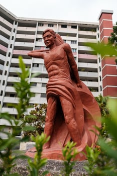 Red Human Statue with Fish in Urban Apartment photo