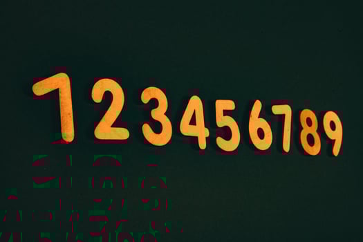 Colorful wooden numbers on black background. Number 1 to 9. photo