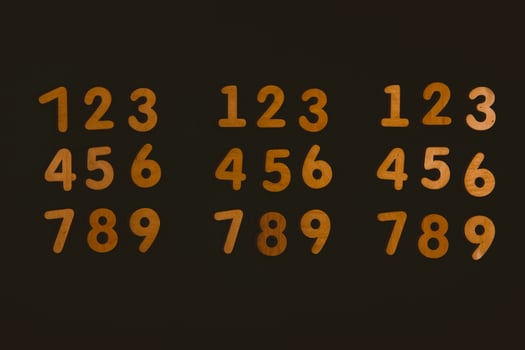 Colorful wooden numbers on black background. Number 1 to 9. photo