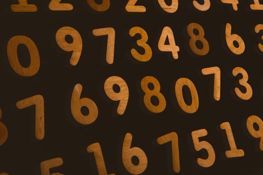 Numbers on a dark background. Seamless pattern. Toned. photo
