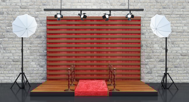 Photo studio wooden background with soft box light, red carpet and barrieres, vip concept,