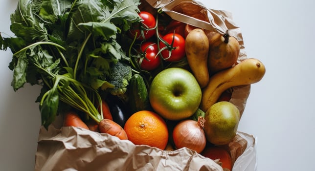 AI generated a paper bag stuffed with fruit and vegetables on a white surface photo