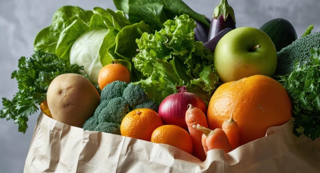 AI generated a paper bag stuffed with fruit and vegetables on a white surface photo
