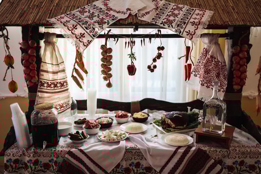 Cossack table in the best restaurants. Festive table at a wedding. Embroidered Ukrainian towel. Red and black color. Traditions. National Ukrainian cuisine. Fat, sausages, alcohol. Catering. photo