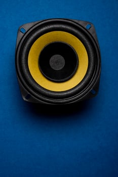 Audio speaker isolated on blue background, Music system background photo