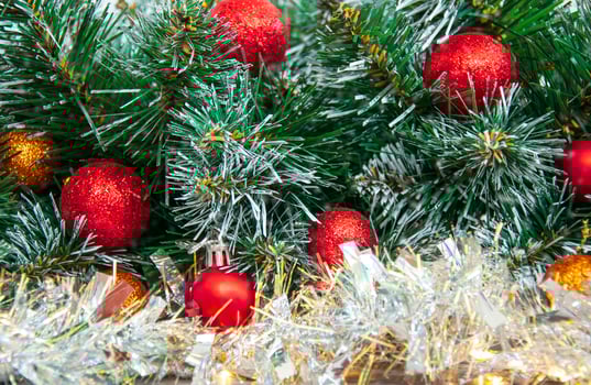 Christmas red decoration close-up on spruce branches. Christmas and New Year holidays background. photo