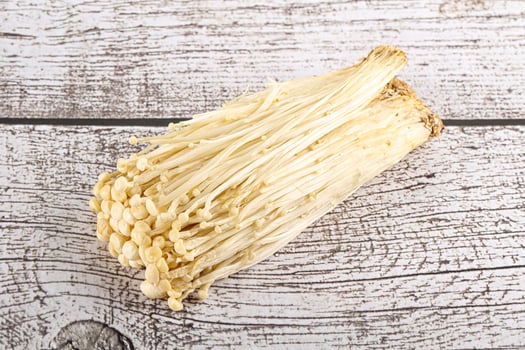 Tasty raw enoki mushroom heap photo