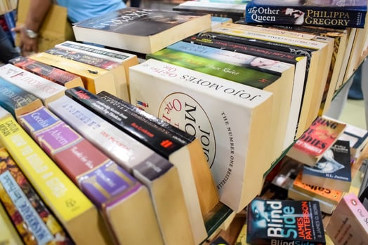 New Delhi, India, September 09 2023 - Variety of Books on shelf inside a book-stall at Delhi International Book Fair, Selection of books on display in Annual Book Fair. photo