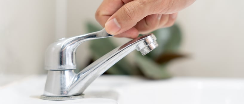 Save water. Man keeps turning off the running water in the bathroom to protect environment. Greening planet, reduce global warming, Save world, life, future, risk energy, crisis , water day. photo