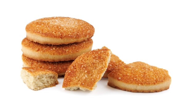 Beautiful round cookies isolated on a white background. Whole and broken cookies. photo