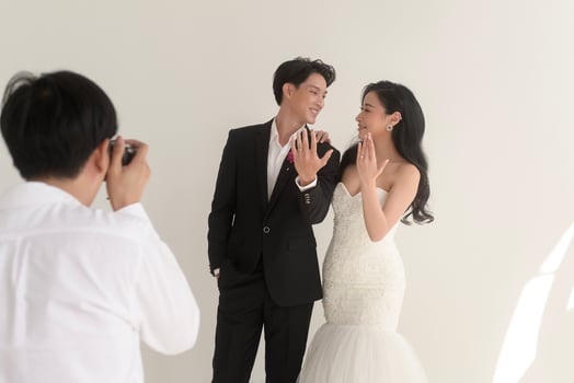 Photographer taking pictures of bride and groom in wedding ceremony, Love ,Romantic and wedding proposal concept. photo