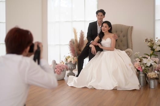 Photographer taking pictures of bride and groom in wedding ceremony, Love ,Romantic and wedding proposal concept. photo
