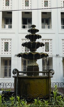 Classic multi tiered stone fountain. antique decoration in garden. photo