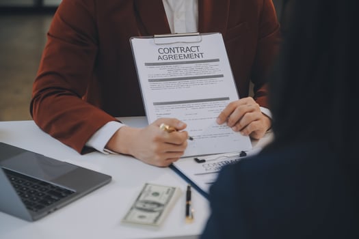 Lawyer, legal advisor, businessman brainstorming information on agreement details Business contracts in legal processing books for accuracy in contract documents. joint financial investment. photo