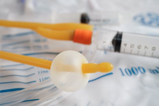 Foley catheter and urine drainage bag collect urine for disability or patient in hospital. photo