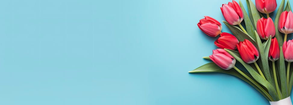 AI generated Bouquet of red tulip on blue Background. Top view with copy space.  AI Generated photo