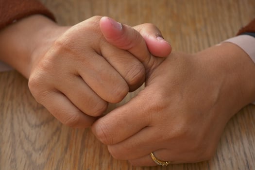Young women hands suffering pain in thumb finger photo