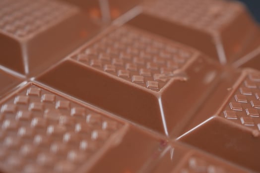 dark chocolate on a plate on table close up photo