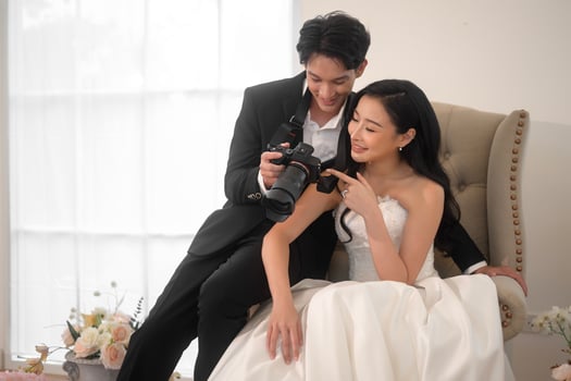 Groom taking pictures of beautiful bride for wedding ceremony, Love ,Romantic and wedding proposal concept. photo