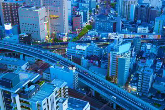 A dusk panorama cityscape near the railway in Osaka telephoto shot photo