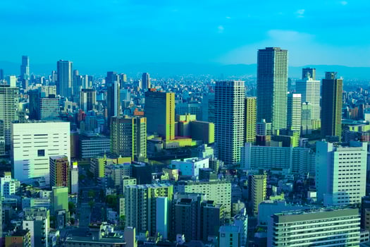 A dusk cityscape by high angle view near the office buildings in Osaka photo