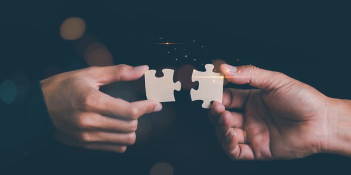 Businessman holding a puzzle piece to find a business solution ,Connecting success and problem solution from creativity ,strategic planning to develop organization into future ,leadership strategies photo