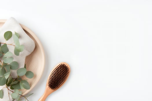 AI generated Wooden hair brush with tray and towel on white background, copy space background for your design photo