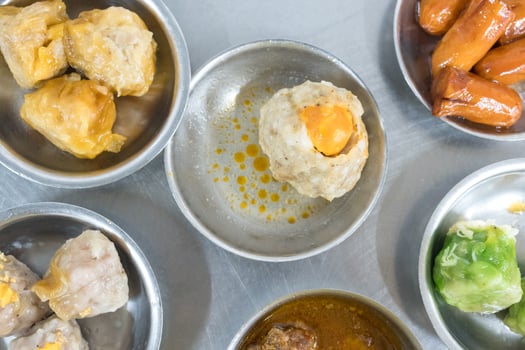 Many kinds of dim sum in a stainless steel mini bowl photo