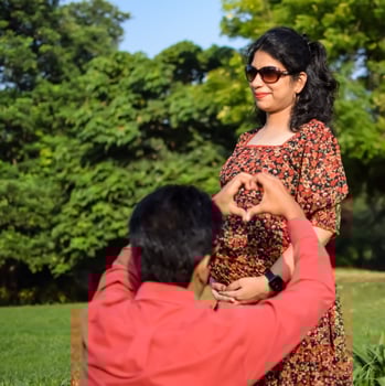 Indian couple posing for Maternity shoot pose for welcoming new born baby in Lodhi Road in Delhi India, Maternity photo shoot done by parents for welcoming their child, Pre Baby Photo Shoot