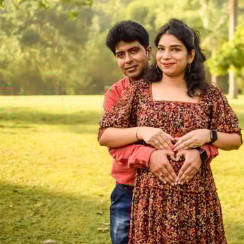 Indian couple posing for Maternity shoot pose for welcoming new born baby in Lodhi Road in Delhi India, Maternity photo shoot done by parents for welcoming their child, Pre Baby Photo Shoot