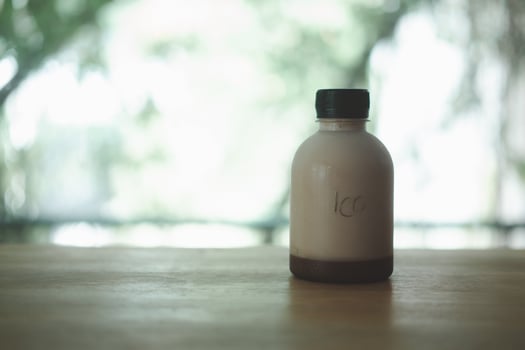 Tasty fresh milk and cocoa in plastic bottle photo