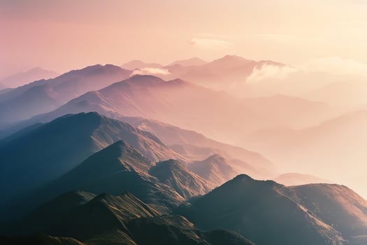 AI generated A breathtaking view of layered mountains bathed in the soft glow of sunset, showcasing a dance of light and shadow. photo