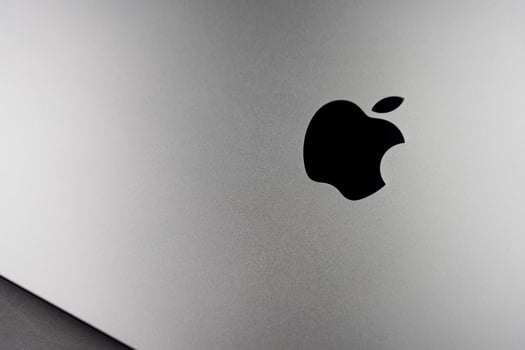 Bangkok, Thailand - December 28, 2023 Macbook logo on space black color metallic aluminum surface photo