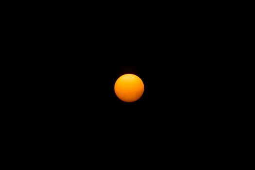 Big sun in the dark background. photo