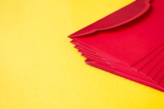 Side view of yellow envelopes on yellow cover with customizable space for text. photo