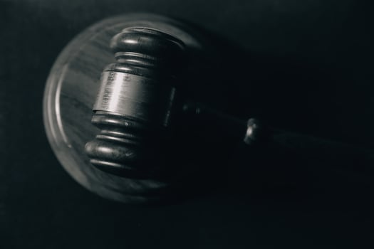 image of judge's hammer, scales lady of justice, law book, laptop computer and contract documents with pen concept of law and justice. photo