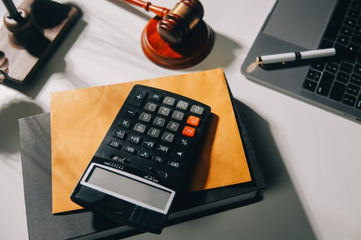 image of judge's hammer, scales lady of justice, law book, laptop computer and contract documents with pen concept of law and justice. photo
