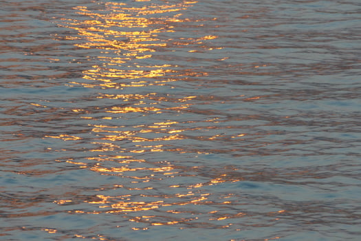 reflected sunlight ripples photo